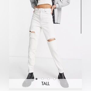 Topshop tall ripped mom jeans in super bleach wash.